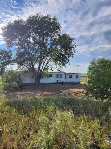 a view of a backyard of a house