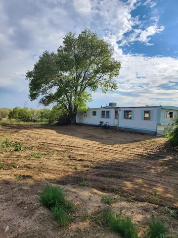 a view of a large body of water with a building in the background