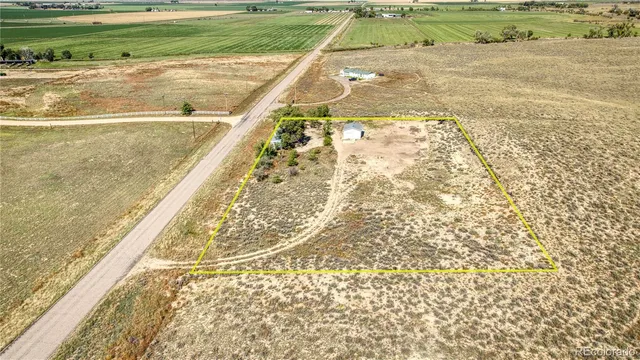 a view of a swimming pool and a yard