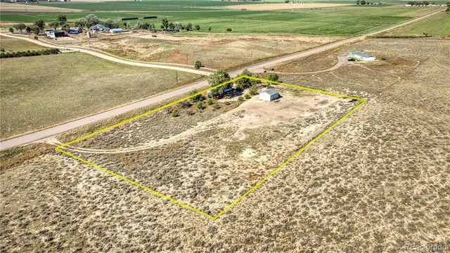 a view of a swimming pool and a yard