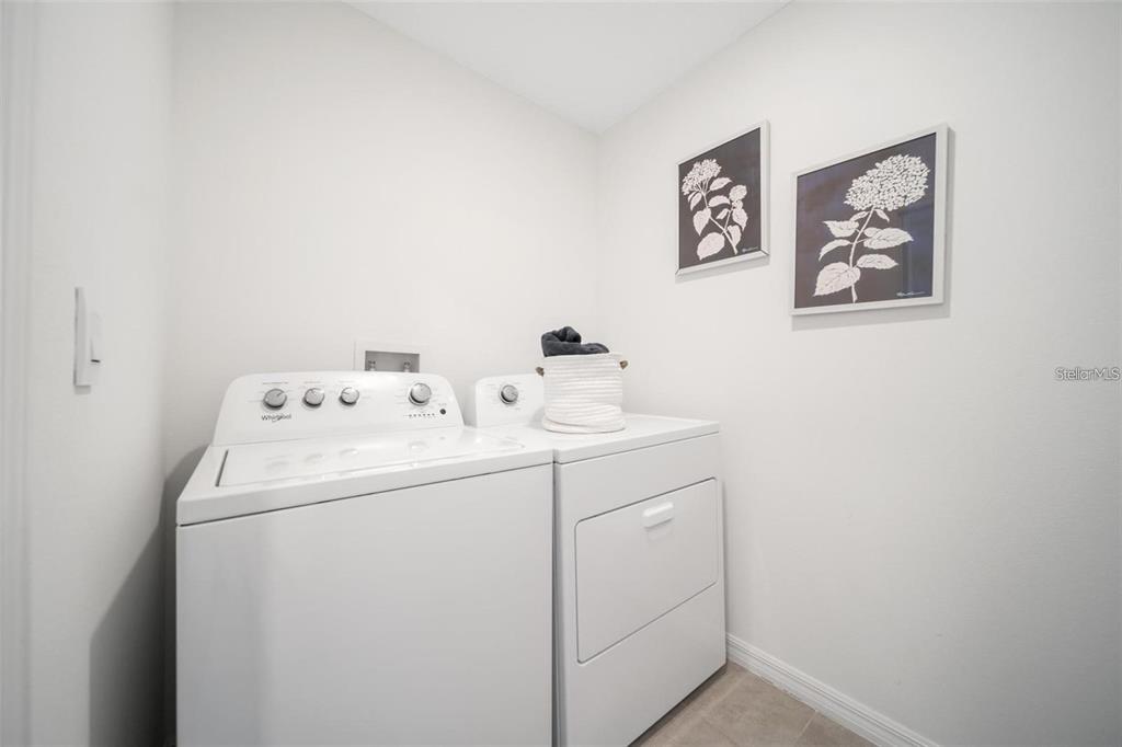 16716 Glacier Bay Loop Wimauma, FL 33598 - Photo 13 of 13 a utility room with dryer and washer