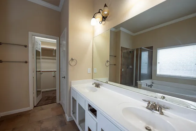 a bathroom with a double vanity sink mirror and double