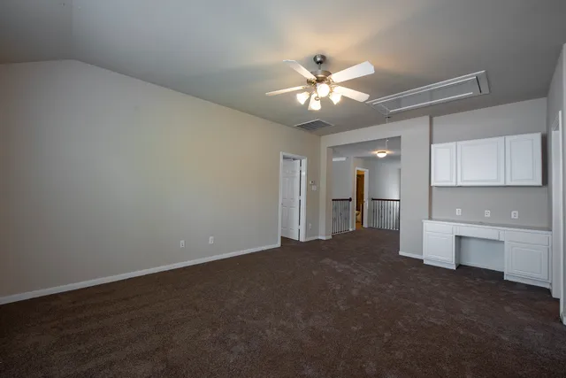 a view of a kitchen with a sink and cabinet