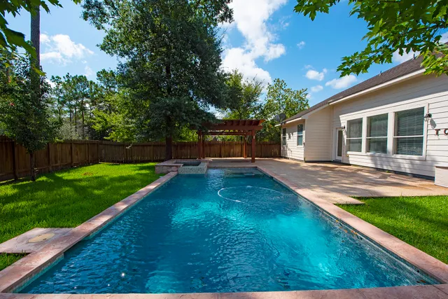 a backyard of a house with lots of green space