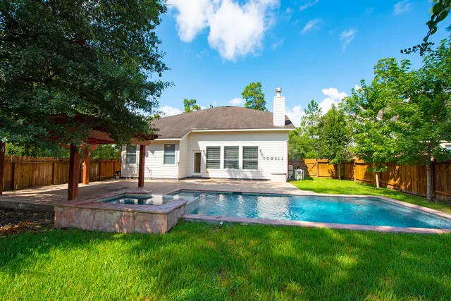 a front view of house with yard and outdoor seating
