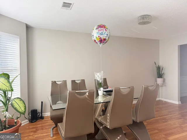 a view of a dining room with furniture