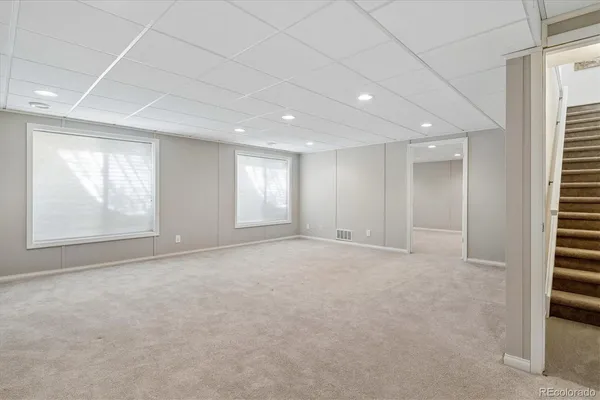 a view of an empty room with windows
