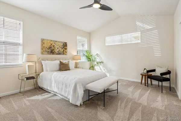 a bedroom with a bed and a chair