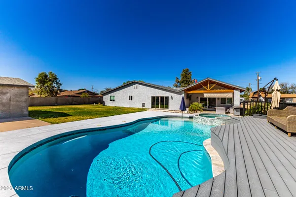 a view of swimming pool with outdoor seating