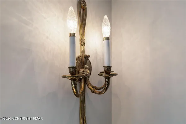 a view of a kitchen with kitchen island granite countertop a table chairs sink and wooden floor