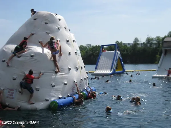 a view of park with seating space and trampoline