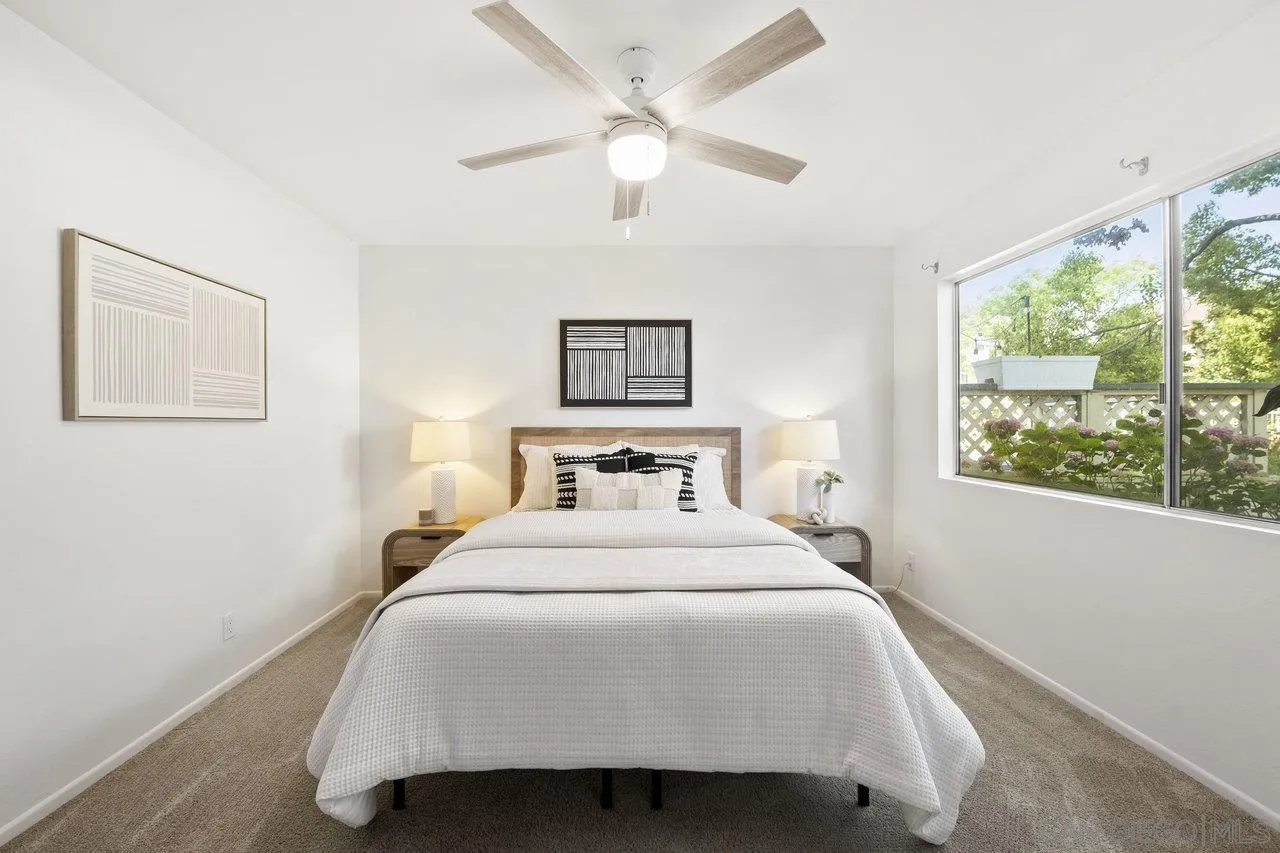 143 Cerco Rosado San Marcos, CA 92069 - Photo 11 of 28 a bedroom with a large bed and a window