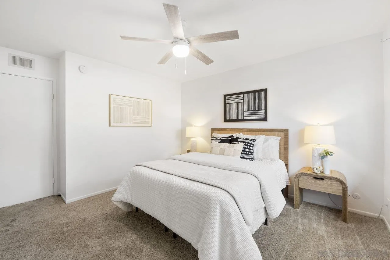 143 Cerco Rosado San Marcos, CA 92069 - Photo 12 of 28 a bedroom with a bed and a painting on the wall