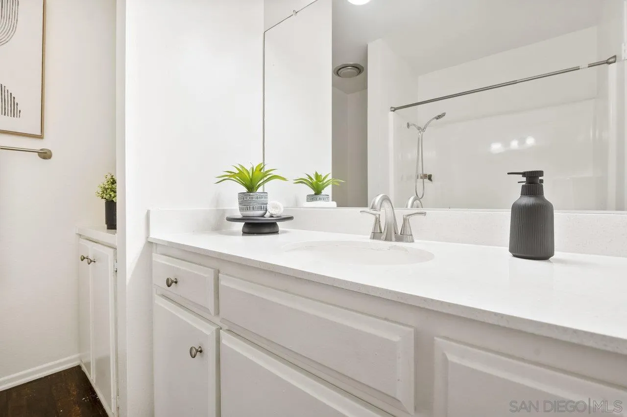 143 Cerco Rosado San Marcos, CA 92069 - Photo 13 of 28 a bathroom with a sink a vanity and a mirror