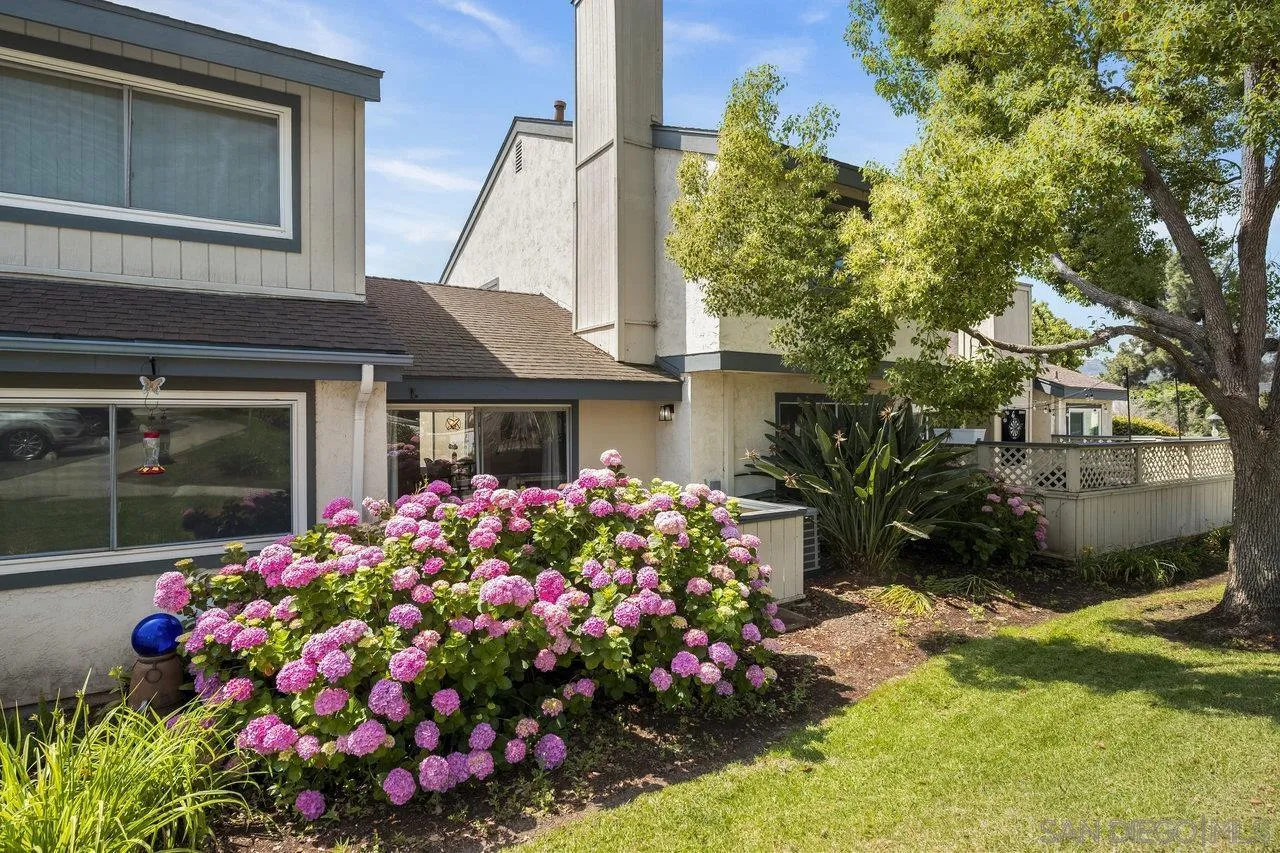 143 Cerco Rosado San Marcos, CA 92069 - Photo 26 of 28 a front view of a house with a yard and fountain