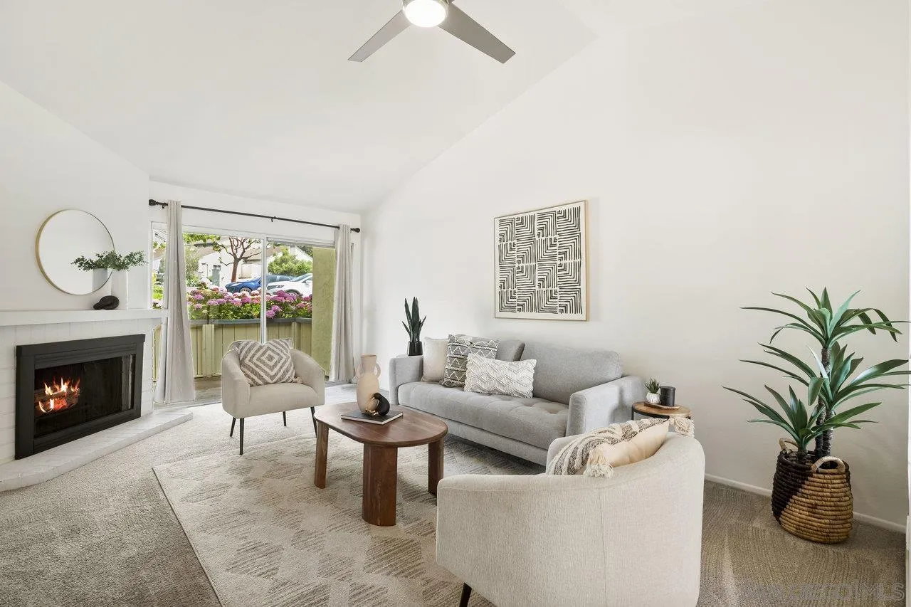 143 Cerco Rosado San Marcos, CA 92069 - Photo 3 of 28 a living room with furniture and a fireplace