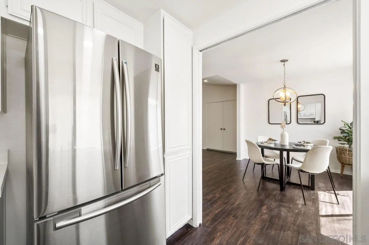 143 Cerco Rosado San Marcos, CA 92069 - Photo 9 of 28 a view of a dining room with furniture window and wooden floor