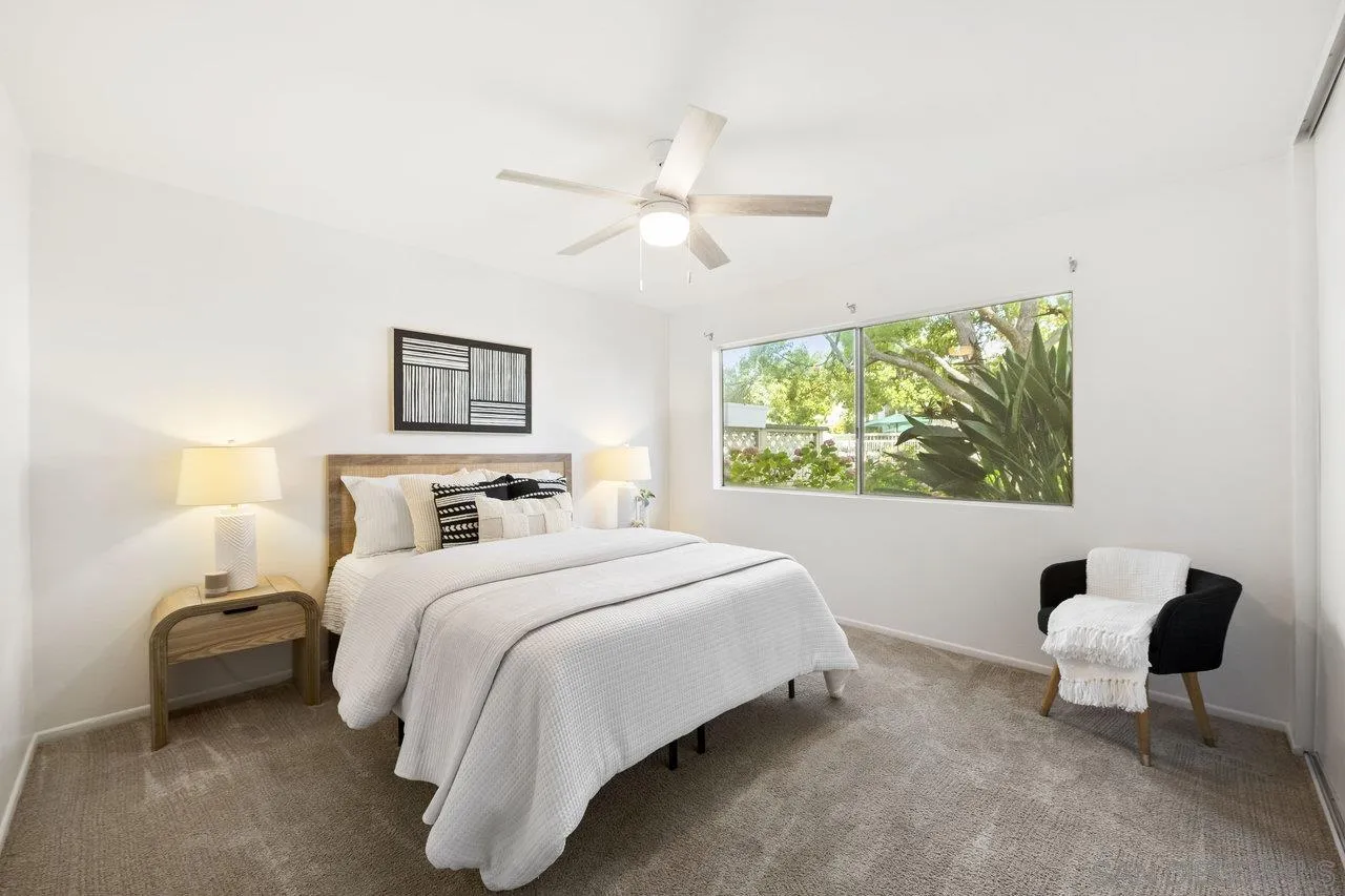 143 Cerco Rosado San Marcos, CA 92069 - Photo 10 of 28 a bedroom with a bed and a large window