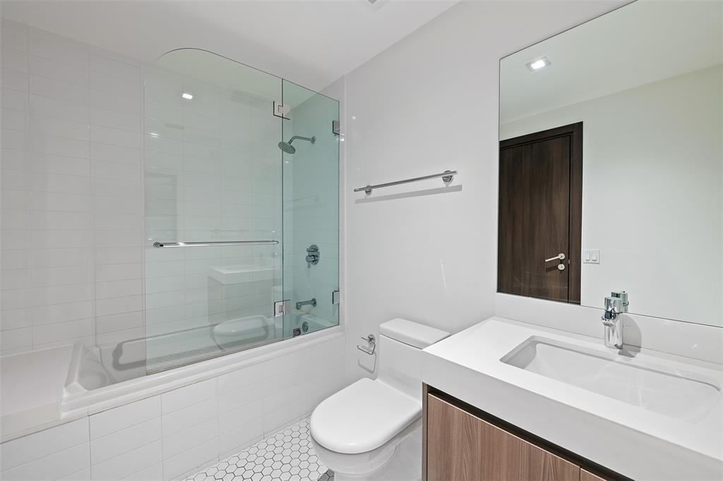 401 North Birch Road, Unit TH7 Fort Lauderdale, FL 33304 - Photo 17 of 33 a bathroom with a sink toilet and shower