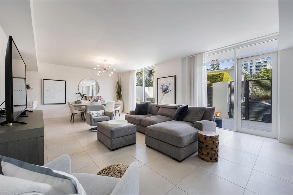 401 North Birch Road, Unit TH7 Fort Lauderdale, FL 33304 - Photo 8 of 33 a living room with furniture and a flat screen tv