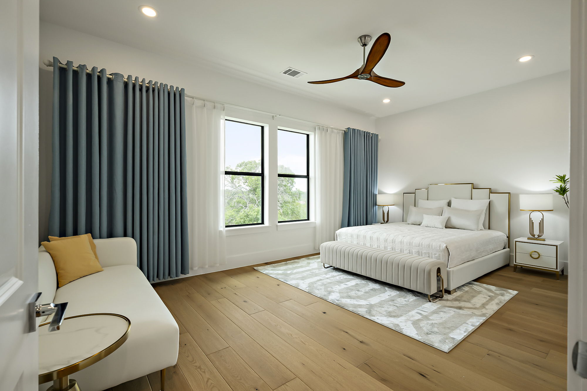 10211 Thistle Ridge Austin, TX 78733 - Photo 33 of 39 Bedroom with recessed lighting, wood finished floors, and a ceiling fan