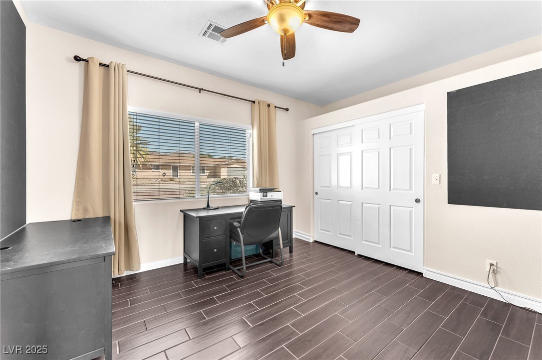 2251 Thoroughbred Road Henderson, NV 89002 - Photo 25 of 60 Office space with visible vents, ceiling fan, baseboards, and dark wood finished floors