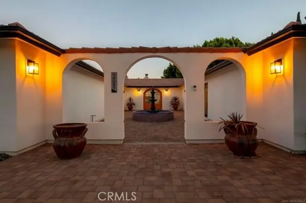 a view of a swimming pool with a patio