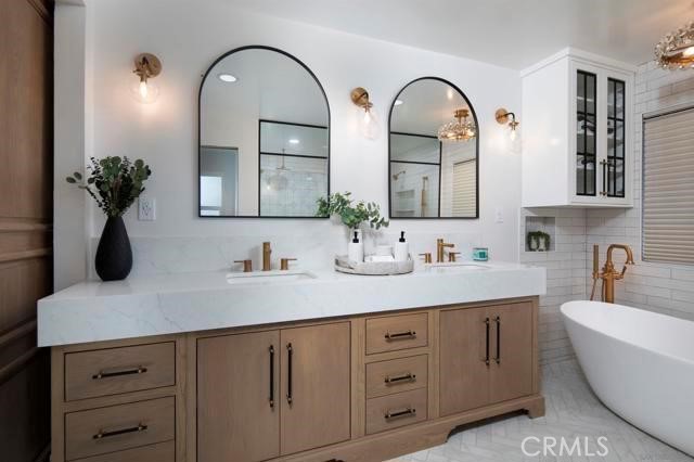 14085 Proctor Valley Road Jamul, CA 91935 - Photo 19 of 70 a bathroom with a double vanity sink and a mirror
