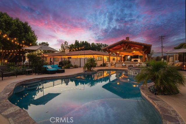 14085 Proctor Valley Road Jamul, CA 91935 - Photo 2 of 70 a view of a swimming pool with a patio