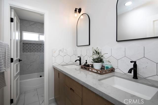 14085 Proctor Valley Road Jamul, CA 91935 - Photo 26 of 70 a bathroom with a sink and a mirror