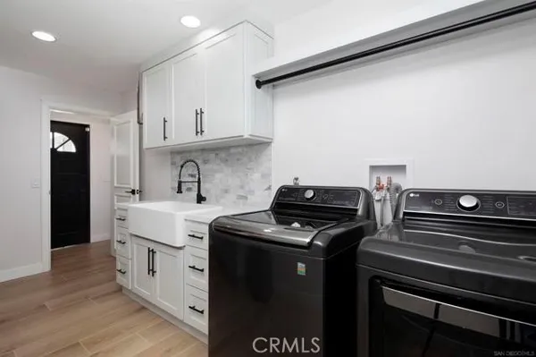 a view of a chairs and table in backyard