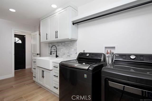 14085 Proctor Valley Road Jamul, CA 91935 - Photo 29 of 70 a kitchen with stainless steel appliances and wooden cabinets