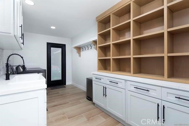 14085 Proctor Valley Road Jamul, CA 91935 - Photo 30 of 70 a kitchen with a sink and a stove
