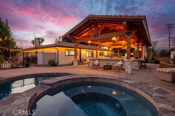 a view of a living room filled with furniture and flower pot