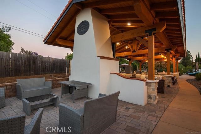 14085 Proctor Valley Road Jamul, CA 91935 - Photo 32 of 70 a view of a patio with couches and table and chairs with wooden fence