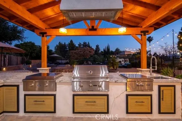 a view of a house with backyard outdoor seating area and furniture