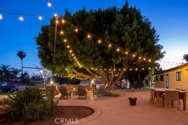 an outdoor space with furniture and umbrella