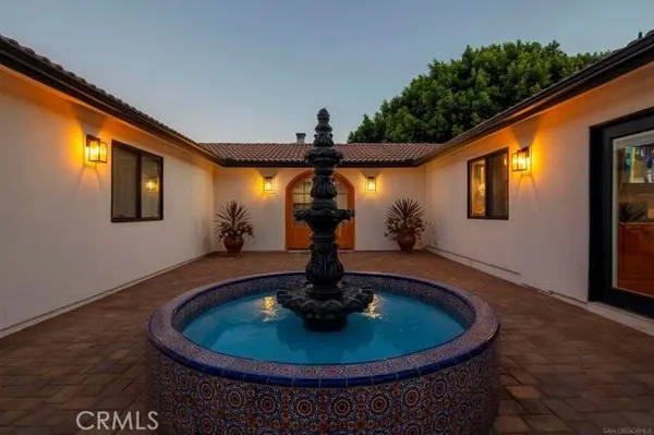 a view of a house with a bath tub and mirror