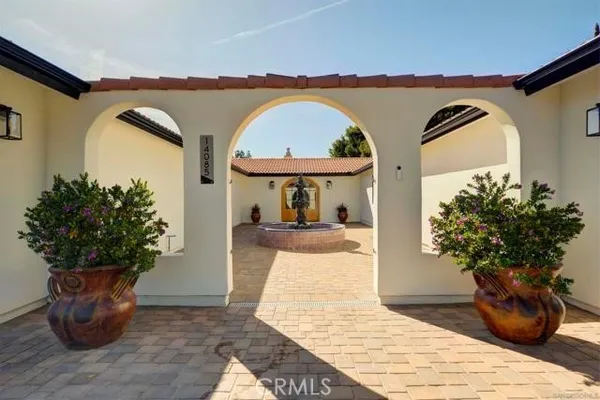 a kitchen with granite countertop a sink and cabinets
