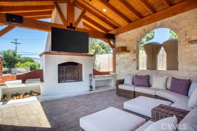 14085 Proctor Valley Road Jamul, CA 91935 - Photo 48 of 70 a living room with furniture a fireplace and a flat screen tv