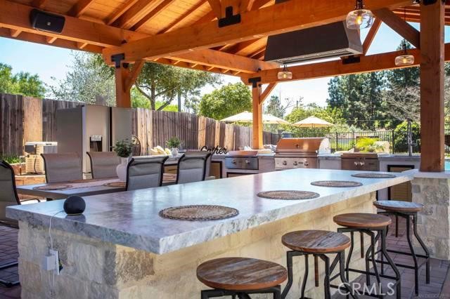 14085 Proctor Valley Road Jamul, CA 91935 - Photo 49 of 70 a outdoor space with patio the couches and pool dining table and chairs with wooden floor