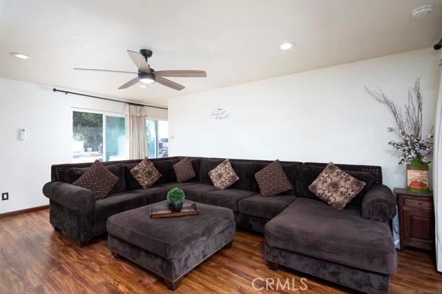 14085 Proctor Valley Road Jamul, CA 91935 - Photo 59 of 70 a living room with furniture and a ceiling fan
