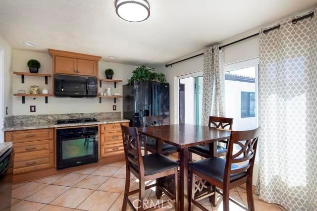 14085 Proctor Valley Road Jamul, CA 91935 - Photo 62 of 70 a dining room with furniture and window