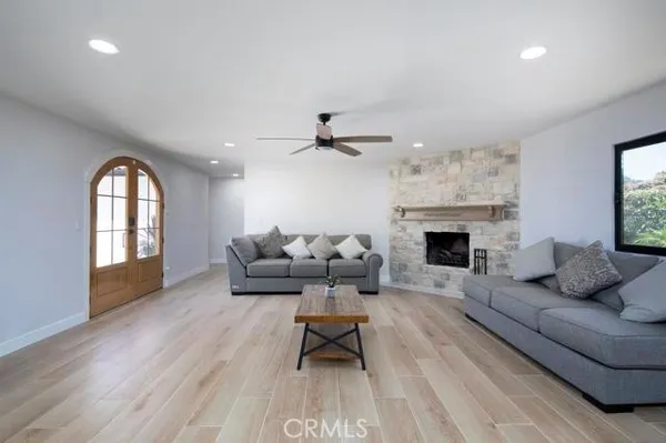 a living room with furniture and a fireplace