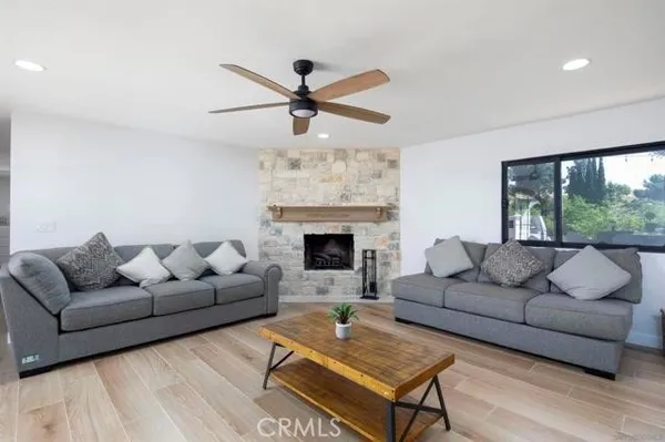 a large kitchen with stainless steel appliances a sink a refrigerator and a stove