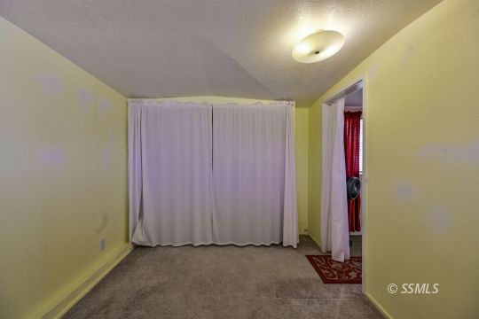 1639 Sims Street Ridgecrest, CA 93555 - Photo 30 of 38 an empty room with a door