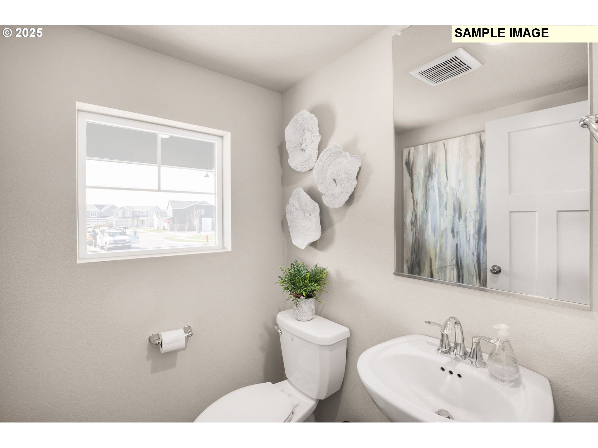 8842 Southwest Choke Cherry Tualatin, OR 97062 - Photo 25 of 29 a bathroom with a toilet sink and mirror