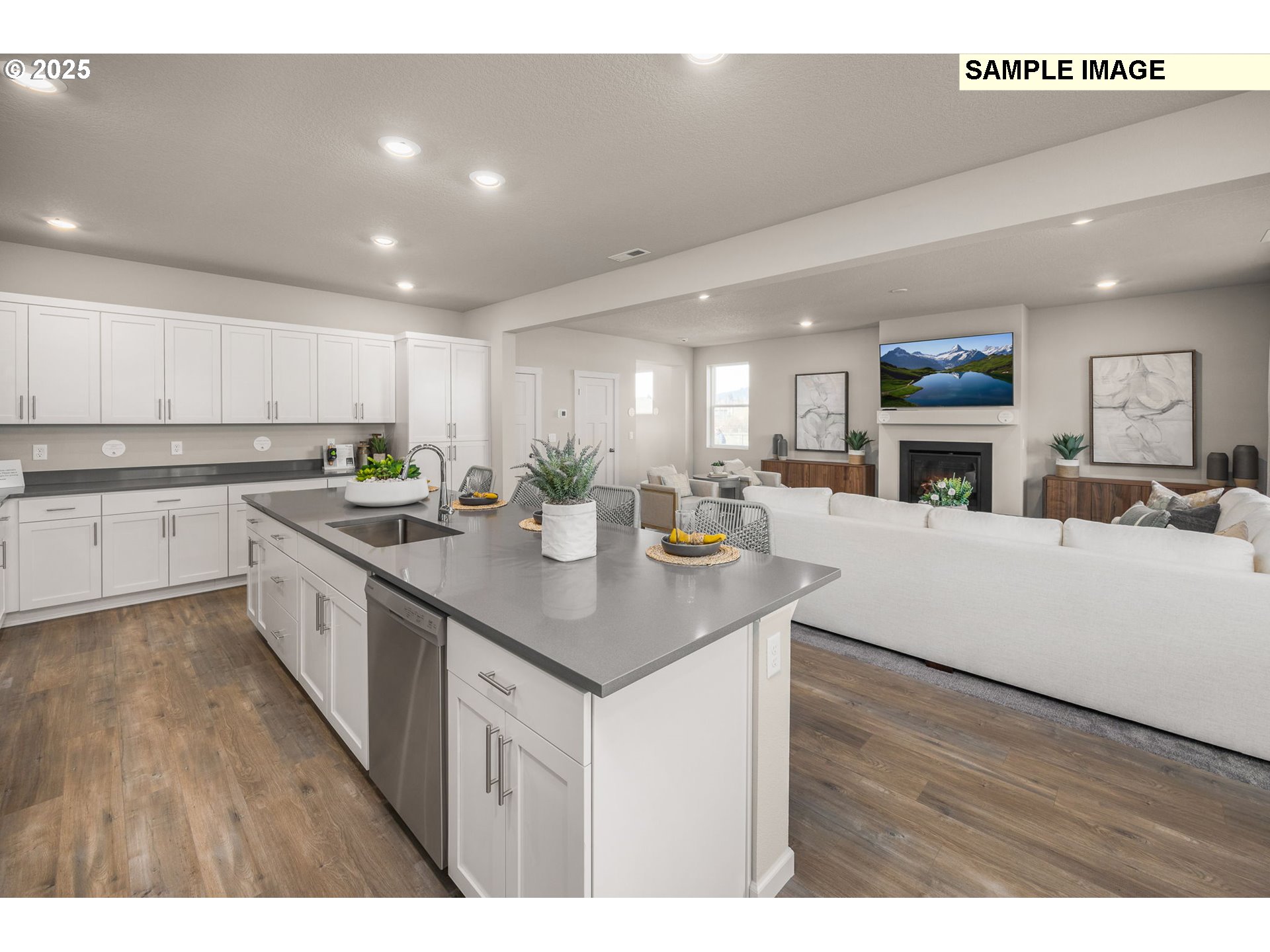 8842 Southwest Choke Cherry Tualatin, OR 97062 - Photo 10 of 29 a kitchen with counter top space a sink cabinets and stainless steel appliances