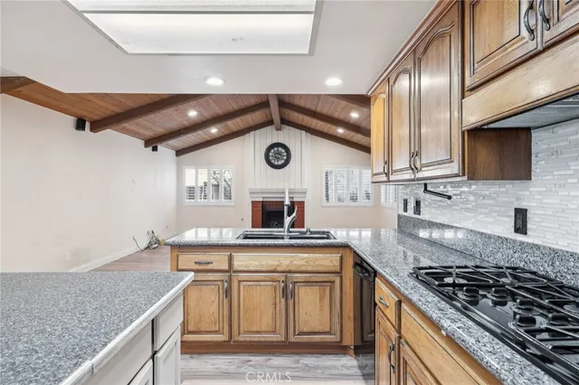 a kitchen with a stove and a sink