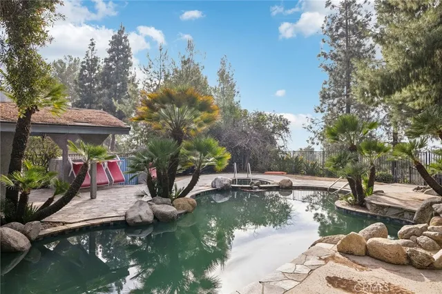 a view of swimming pool with a patio